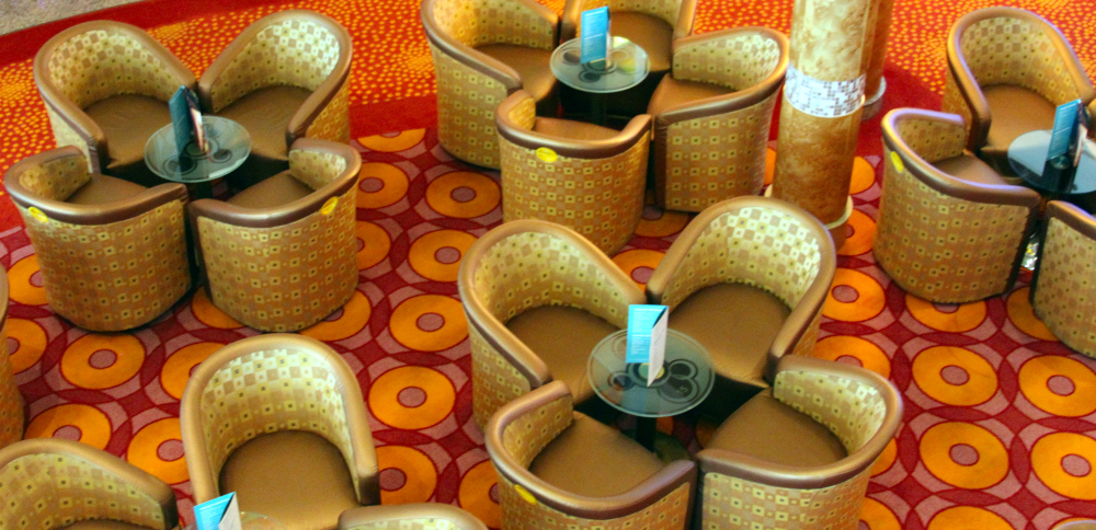 Overhead view of patterned chairs and tables arranged in circles, symbolizing connection and rest, illustrating concepts from a Somatic Exercises List for relaxation and balance.