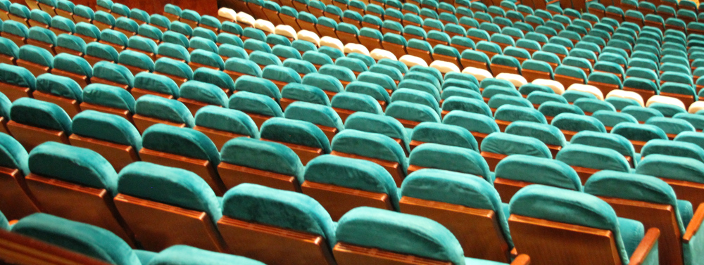 Somatic Symptom Disorder involves persistent focus on physical symptoms that may feel overwhelming. The empty rows of seats here reflect repetition, isolation, and ongoing struggle. Somatic Symptom Disorder represented by endless rows of empty seats, symbolizing the ongoing struggle of physical symptoms that can feel repetitive, isolating, and overwhelming.