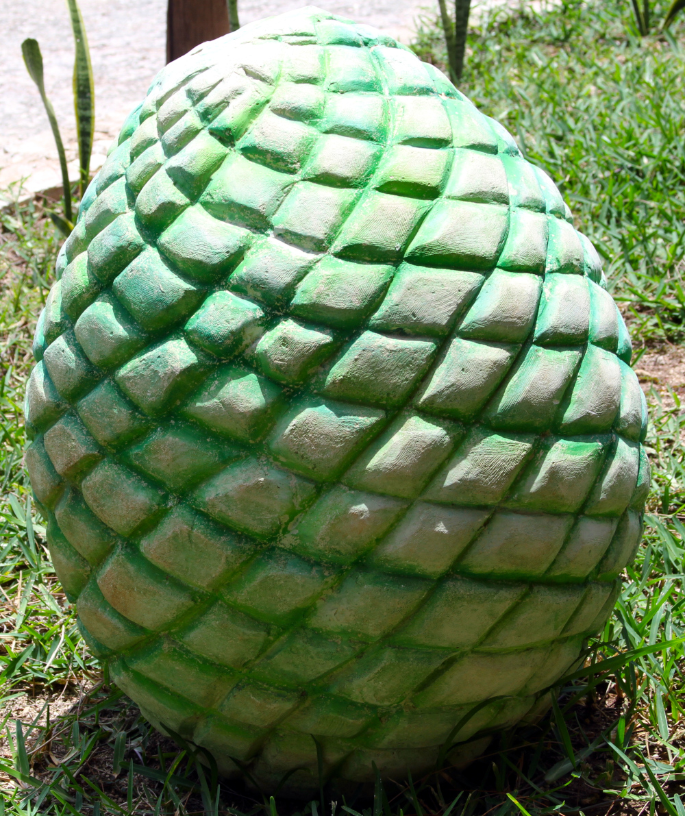 Somatic Symptom Disorders involve ongoing physical symptoms that feel overwhelming. The textured stone reflects their weight and complexity in daily life. Somatic Symptom Disorders symbolized by a textured green stone sculpture, reflecting the layered and complex nature of physical symptoms that can feel heavy and difficult to carry.