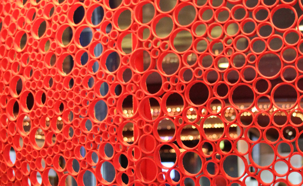 What is Somatic Symptom Disorder? A condition where normal body sensations feel amplified and distressing, shown here through repeating circles that reflect ongoing symptoms. What is Somatic Symptom Disorder represented by a pattern of red circles, symbolizing how repeated physical sensations can feel overwhelming and interconnected in daily life.